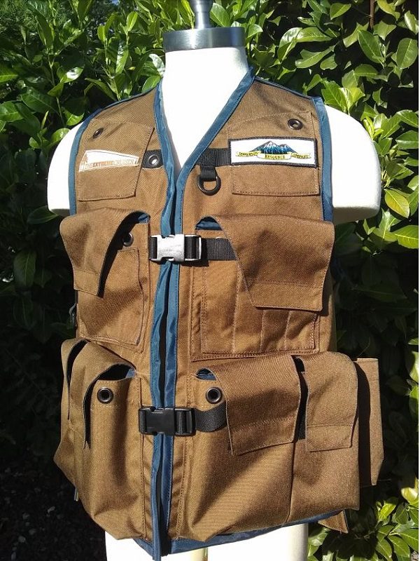 An Image of The Klamath Cruiser Vest In Coyote Tan With Navy Blue Binding