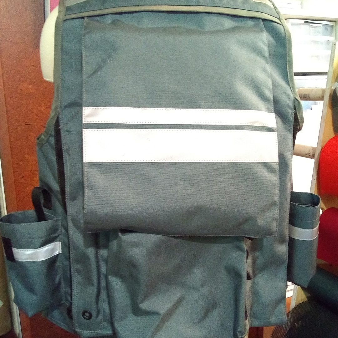 Image of The Back of A Klamath Extreme Cruiser Vest In Smoke With Charcoal Binding & Reflective Tape