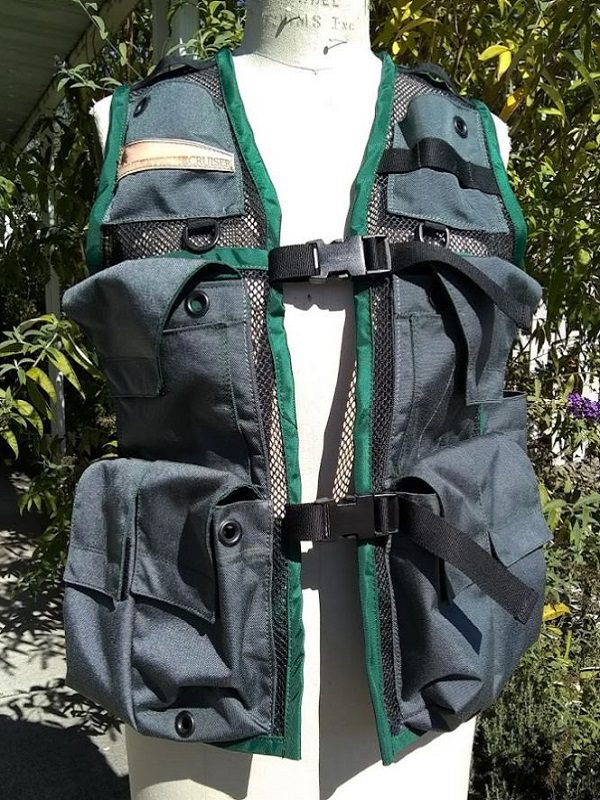 Image of a Woman's Siskiyou Extreme Cruiser Vest In Grey with Forest Green Binding